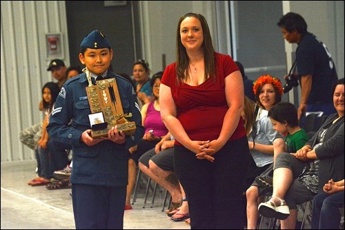 Top Second Year Cadet Cpl. Jett Yeung accepts her award from civilian instructor Shaileene Hall