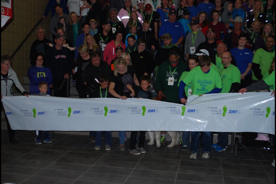 The youth ambassadors for the Humboldt and District Juvenile Diabetes Walk, Ashton Nakrayko and James Burkhart, cut the ribbon officially starting the walk at the Humboldt Uniplex on June 14.