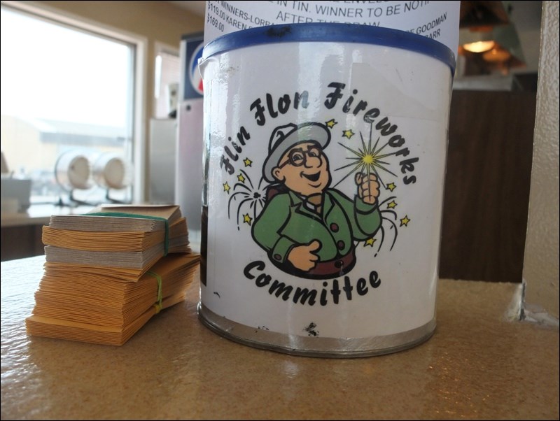 Flin Flon MLA pats Flinty on the back over roadside attraction honour Flin Flon Reminder