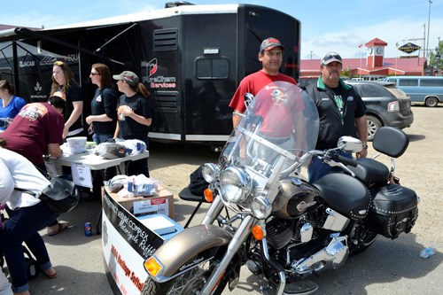 The 2015 edition of Boogie Fest kicked off with a free lunch and ticket blitz at Carlyle Home Hardware, as attendees took advantage of the last chance to enter the draw for this year's prize-a 2004 Harley Davidson Heritage Soft Tail. Boogie Fest board member Trevor Dalziel found the    motorcycle and said, “This year we were able to get a really great bike. It's a 2004 Heritage Soft Tail with only 287 km on it. It's like brand new.” Pictured are two past winners-who purchased tickets this year-(l-r) Brent Stillwell of Carlyle and Brian Werstuik of Kisbey.