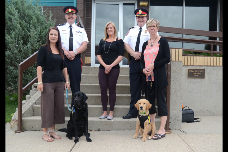 Weyburn police Chief, Marlo Pritchard, top left, and Estevan police Chief Pail Ladouceur, top right, stand by Tara Busch, victim services coordinator for Southeast Regional Victim Services, bottom left, and Laura Watamanuk, executive director for PADS, bottom right. Southeast Regional Victim Services assistant coordinator Terri Campbell, centre, was also on hand during the official announcement.