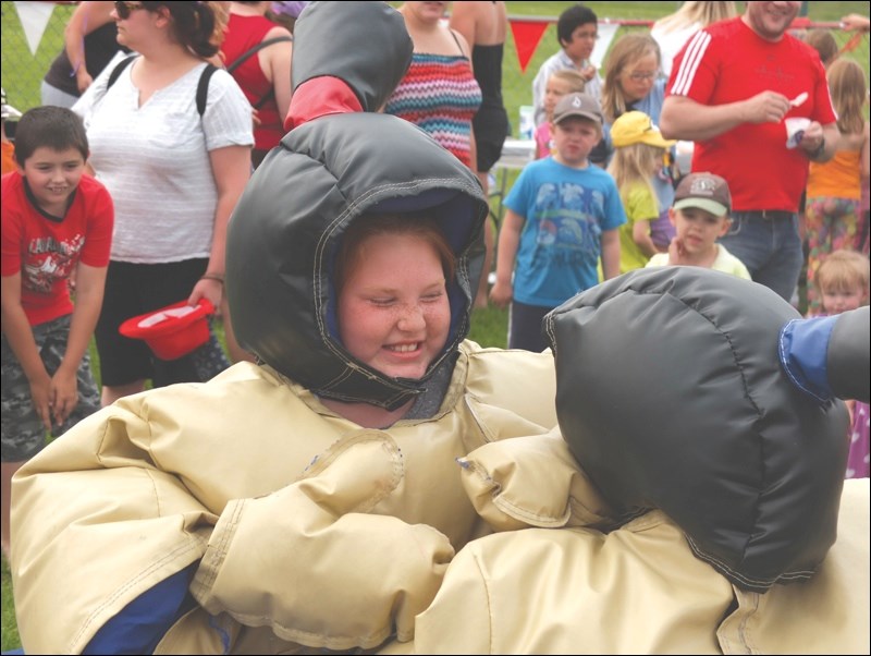 Annae Esmond, 10, wrestled in a sumo suit at Creighton’s Canada Day celebrations.