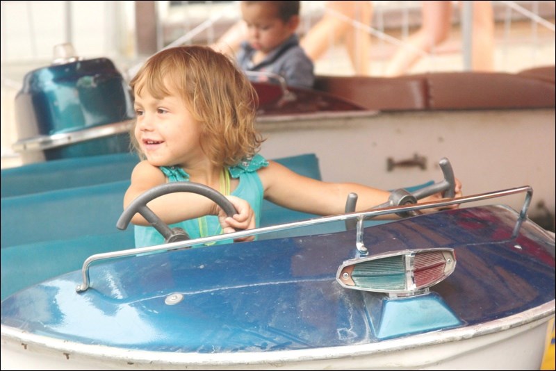 Lexi Richard took a cruise in one of the boats during the Flin Flon Trout Festival Main Street Days on Friday, July 3.