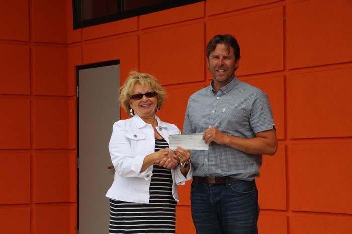 The Yorkton Community Clubhouse project is racing towards completion, and Miccar Aerial/Good Spirit Air Service has gotten on board to support the project. Carol Yaholnitsky with Miccar Aerial/Good Spirit Air Service, presenting $500 to Jason Farrell of Yorkton Minor Football, says that they are all about family and the well being of kids, so they felt that this was a project they had to support within the community. She’s also impressed with the building so far, as well as the field and track at Century Field, and believes it will open up many opportunities for the city.