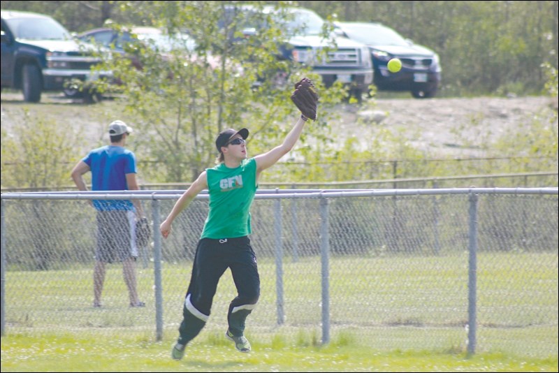 Tyler Rice reached for a pop fly during the playoff portion of the Cash Tournament held July 10 to 12.