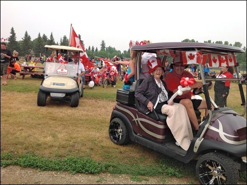 The Meota Canada Day parade was led by Mayor John McDonald accompanied by his mother Patricia, followed by Pearl Hawkin’s mother Eugena Swayzy and her son-in -law Terry Kuchur. Terry and his wife Joan are sponsors of the parade along with the Village of Meota and Walmart, who donated the wieners and buns. The regional park campers took care of the food booth. There must have been nearly 100 bikes with riders of all ages and they all seemed to enjoy their day. Folks watching surely did, too. Photos by Lorna Pearson