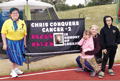 Dana Prystupa and her children, Luca and Jovi, of Yorkton were very moved by the tribute to the late Lorraine Naduriak (Dana’s mother) made by the Canora team which participated in the Relay For Life in Yorkton during the weekend. The team was led by Chris Bilsky (left).