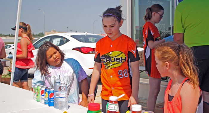 The Yorkton Crush girls softball program got a boost of $934 from a barbecue fundraiser held at Yorkton Hyundai last week. The money will be used to buy equipment, particularly bats and catcher gear, needed because of rapid expansion of the organization, explained Vaughan Fleger, Crush president.