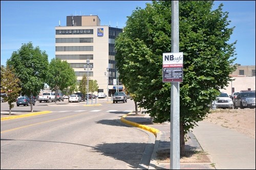 Downtown North Battleford’s safety initiatives include prominent signs listing numbers to call if dangerous or criminal activity is witnessed. Photos by John Cairns