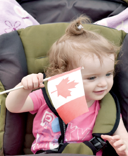 Among youngsters who enjoyed waving the flag at the Kamsack sports ground on Canada Day was Keeva Ferrill of Kamsack.
