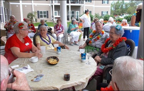Caleb Village residents decked out in colourful Hawaiian Day finery. Photos submitted