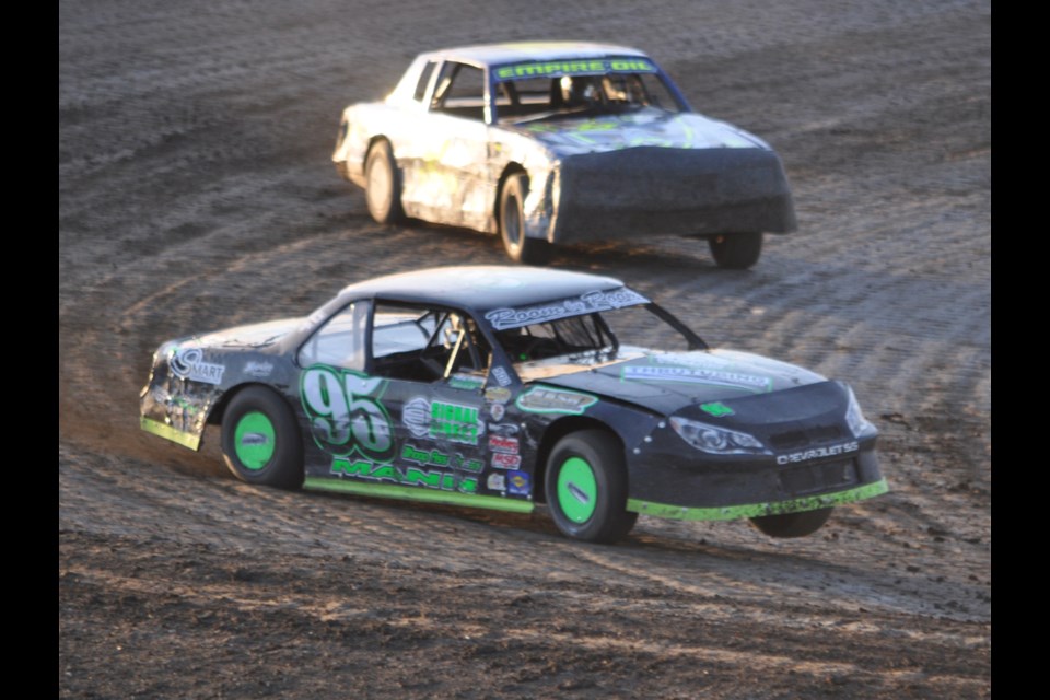 Gregg Mann nearly flies off the track on the first corner while Blaine Durward follows close behind during the stock car heat at Estevan Motor Speedway.