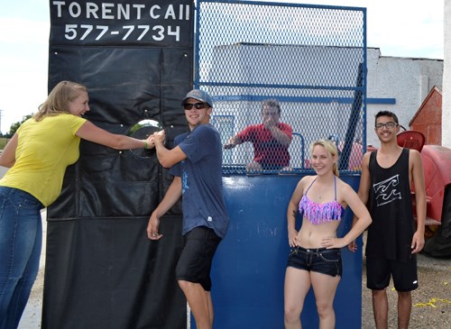 The Class of 2017 got an early start on their graduation fundraising as they manned the dunk tank at Wawota Heritage Days. Pictured are (l-r) future grads Lauren Wilson, Parker Weatherald, dunkee Reed VanDresar, Hope Puskas and Noah Ali. “It's been a very good day for us,” said Weatherald. “And the hot weather really worked in our favour.” (Staff photo by Lynne Bell)