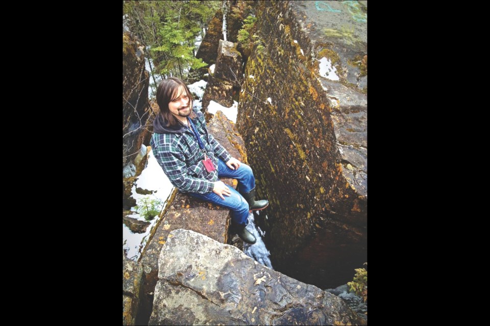 Kevin Imrie sits among the limestone crevices outside Denare Beach last spring.