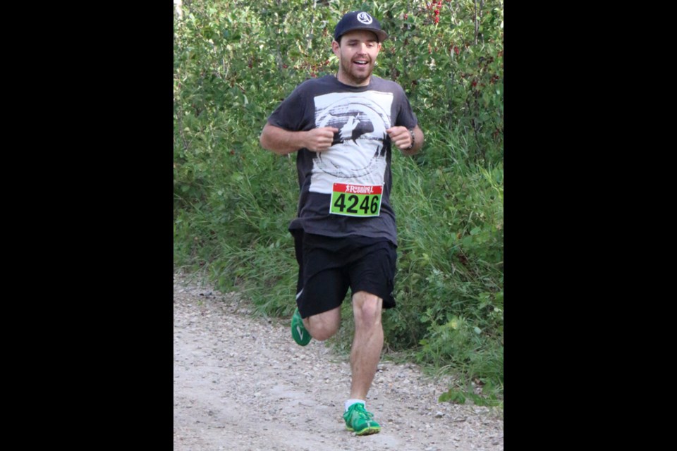 Dylan Kent happily tackles the 10 km run at the Moose Mountain Marathon. He finished with a time of 51:04.