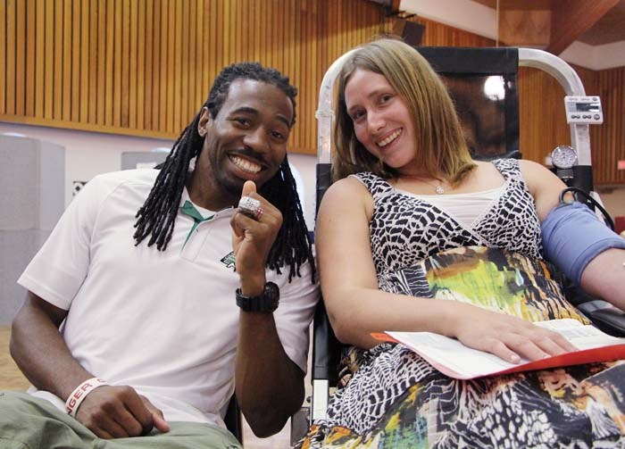 Bleed Green – The Saskatchewan Roughriders want people to bleed green, and they’re encouraging everyone to take the time to give blood to Canadian Blood Services. Chris Best and Weldon Brown were in town to meet people who were giving blood, and Best himself signed up to make a donation of his own. Pictured above, Brown (left) talks to Twyla Johnson, who donated blood and brought her kids along so they could meet the players. “It’s something you’re giving away to help people live life to the fullest,” Brown says.