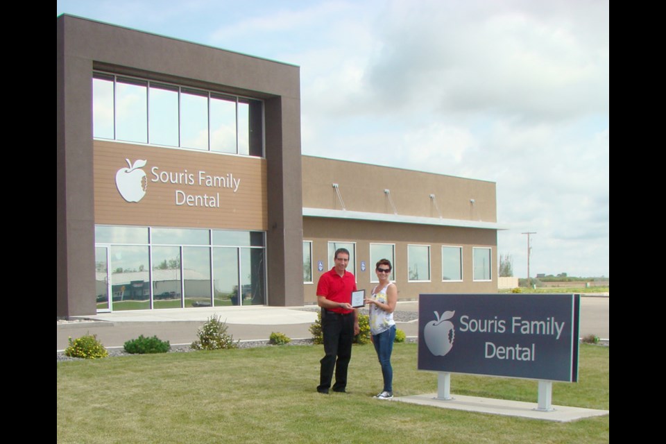 Weyburn Chamber of Commerce Director Twila Walkeden presented Dr. Kevin Aasen of Souris Family Dental with a plaque honouring the company for first place in the Commercial Services Division of the Weyburn Clean-up Campaign.