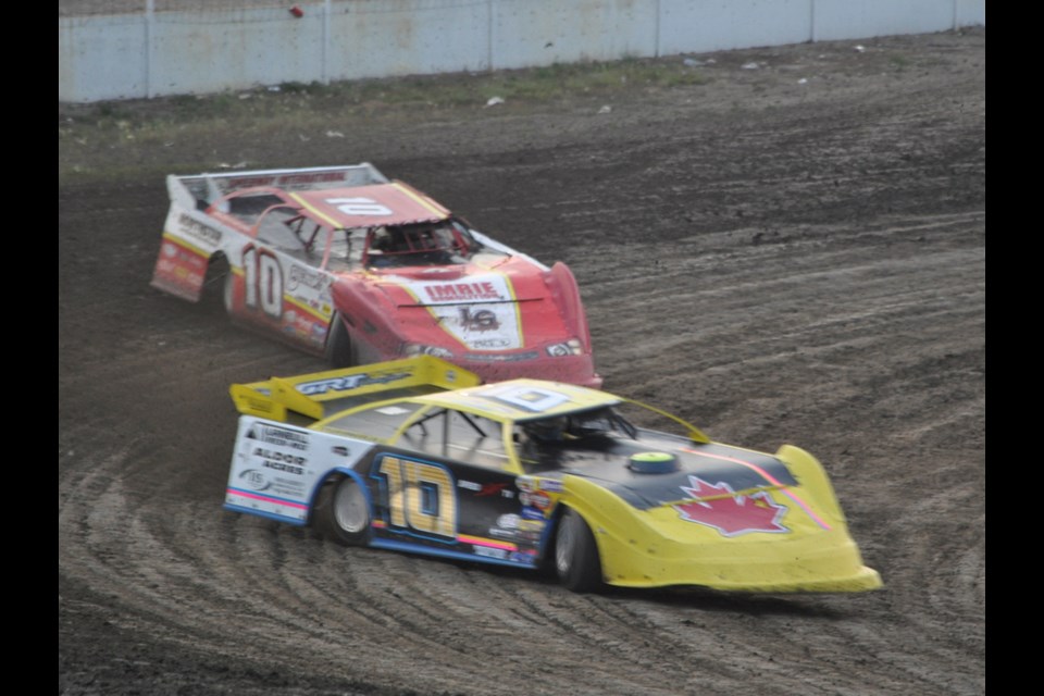 Tyson Turnbull enters the first corner during a Northern Thunder Dirt Late Models heat last Saturday at the Estevan Motor Speedway, while Winnipeg's Mike Balcaen follows close behind.