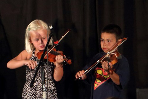 Two young fiddlers take to the stage during the student showcase on Friday, Aug. 14, during the Kenosee Lake Kitchen Party Week 1 performance.