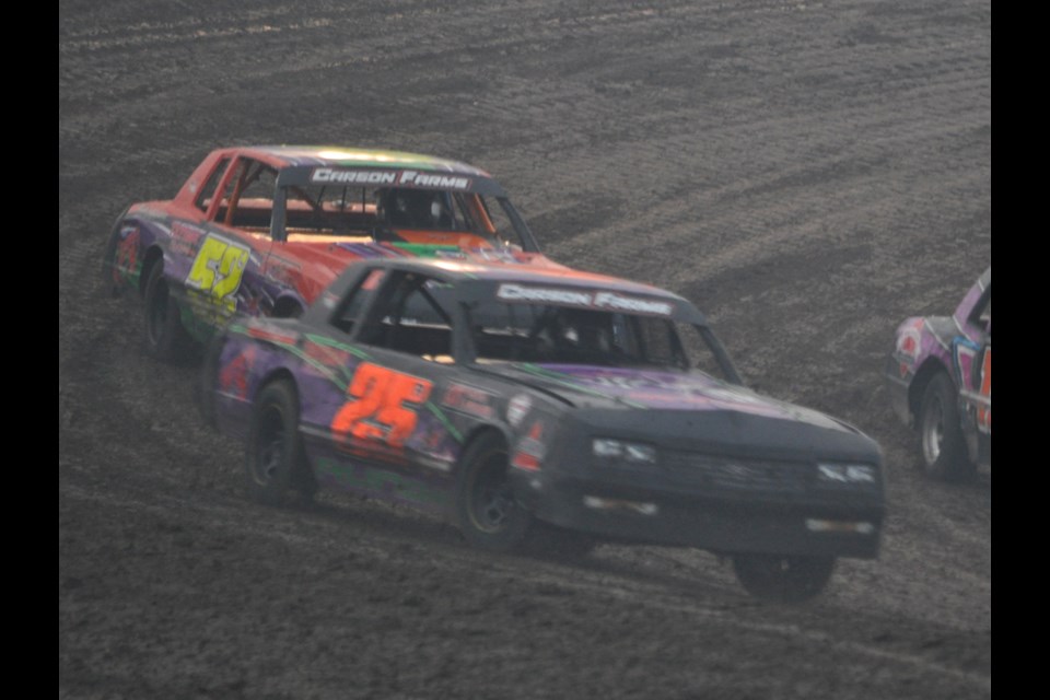 Estevan Motor Speedway Weatherford Hobby Stock season champion Leevi Runge, 25R, leads Landon Runge, 52L, and Beth-Ann Goudy in a heat race last Saturday at the racetrack.