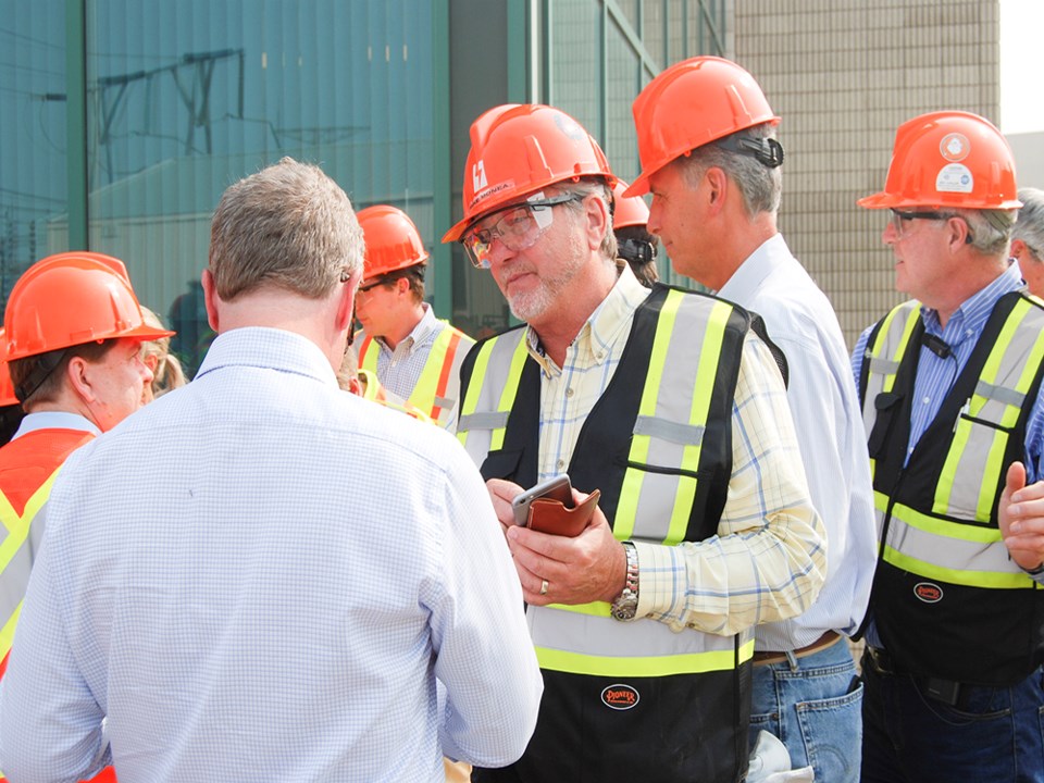 Mike Monea with Brad Wall at Boundary Dam