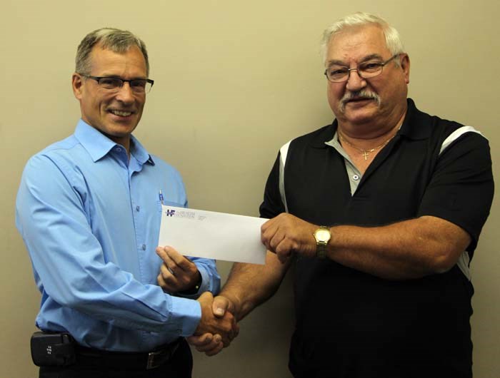 Paying back – Nestor Mykytyshyn (right) is helping replace the CT Scan at the Yorkton Regional Health Centre. He says that he decided to make his contribution of $1,500 because of his own time in the hospital this winter, where he experienced exceptional care. After learning the CT Scan would need replacement, and knowing he needed to use the current machine, Mykytyshyn says he views it as a way to pay back the region for the service he received. Ross Fisher, Executive Director of the Health Foundation, says that they need to raise $200,000 before the end of the year to pay for the machine.