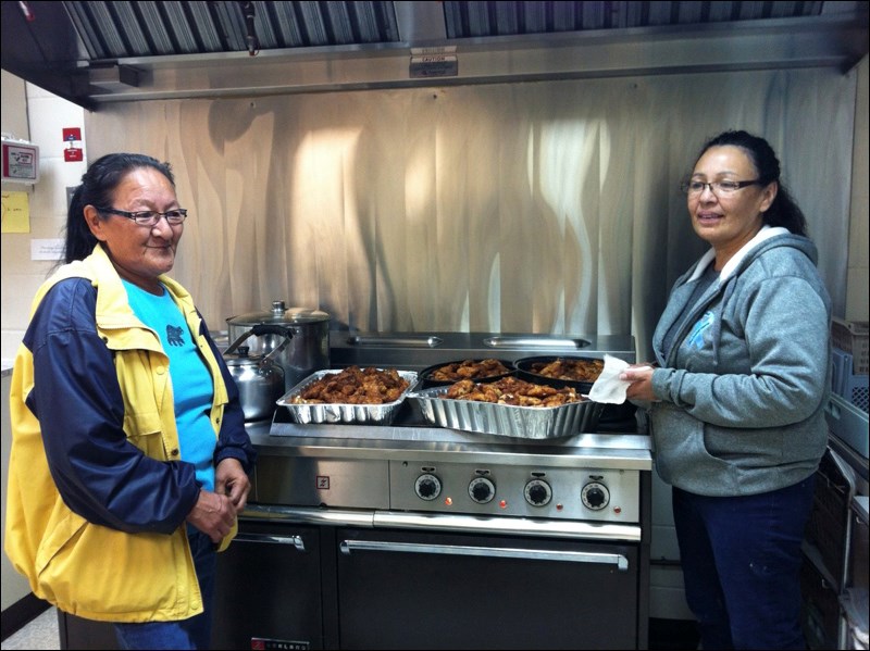 Hilda Cook and Mary Ann Olson prepared a lunch of bannock and walleye to celebrate the grand opening of the new building.