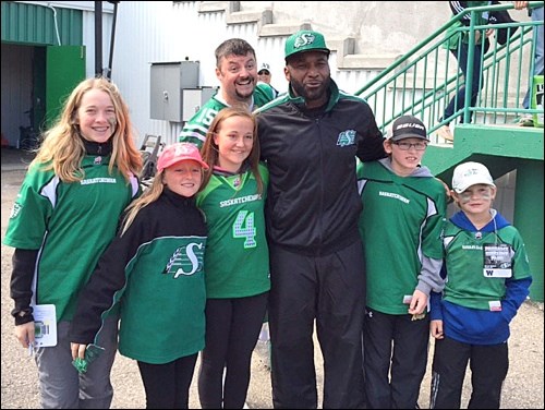 The experience of a lifetime was had at the annual Labor Day Classic when some Unity kids had the priviledge of meeting Darian Durant while also being photobombed by kicker Paul McCallum.  Left to right are Madison Gilbert, Emily Smith and Courtney Smith alongside of Darian Durant. The boys in the photo are great-nephews of Scott Smith of Unity, Zack Dean of Macklin and Austin Schaeffer of Kindersley. Scott Gilbert said he was quick to mention to Durant the appreciation of the town of Unity for his organization and hosting of a fundraiser for the Surine twins, as Gilbert mentioned the Surine family hailed from Unity. Photo provided by Scott Gilbert