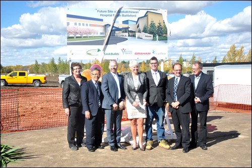 Officials unveil the sign showing the new Saskatchewan Hospital and integrated correctional facility. Pictured are Prairie North board chair Bonnie O’Grady, CEO David Fan, Health Minister Dustin Duncan, Corrections and Policing Minister Christine Tell, Saskatchewan Hospital patient Wade Compton, Environment Minister Herb Cox and Graham Construction president Grant Beck. Photos by John Cairns