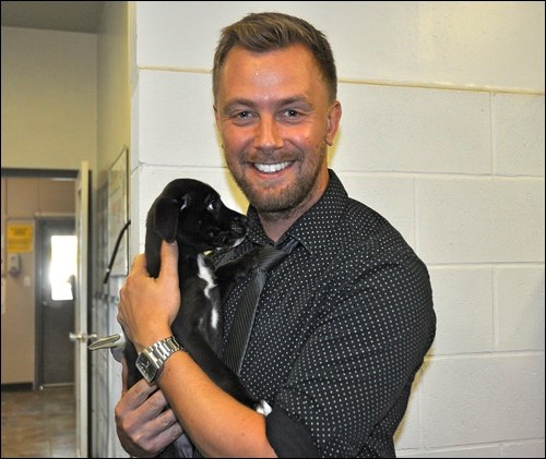 Saskatchewan Country Music Association's 2015 Male Vocalist of the Year Codie Prevost with Flower, the last of a litter of six orphans, who awaits adoption. Prevost was on a tour of the animal shelter in North Battleford as part of a fundraiser for the Battlefords Humane Society. He and his wife have two Chihuahuas.