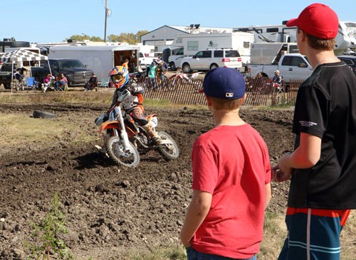 A crowd surrounds the motocross track in Carlyle to watch the Southeast Corner Racing Circuit.