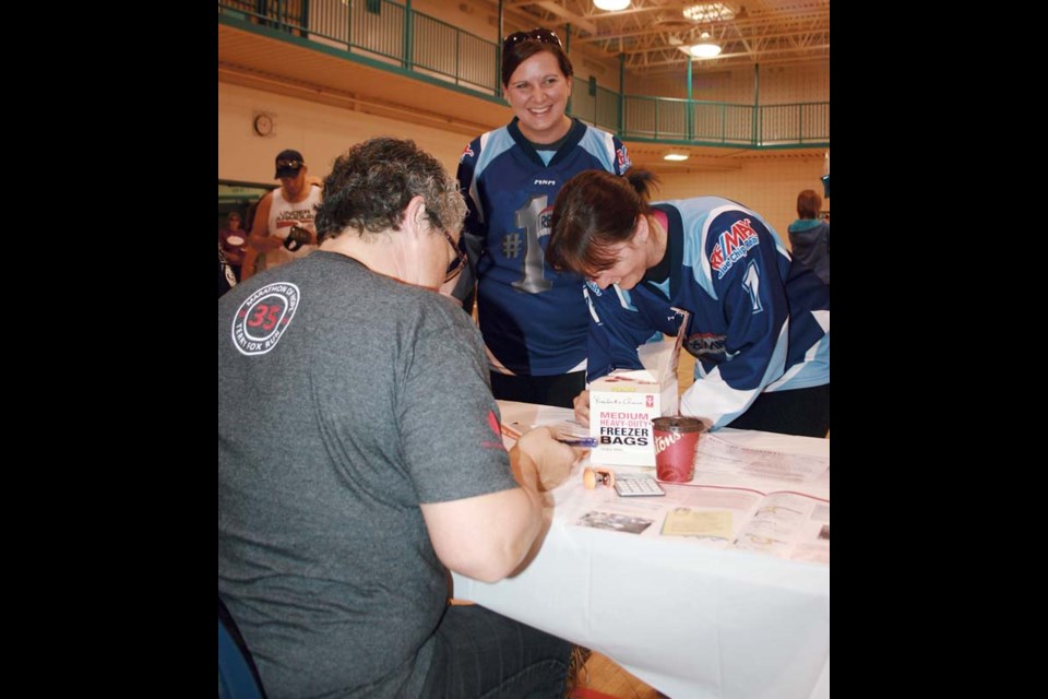 The annual Terry Fox Run was held in Yorkton Sunday, starting at the Gloria Hayden Centre. Here Candice Jesmer and Cameo Britton of team Re/MAX sign in prior to the event. The run, which has been held in communities across Canada for 35 years, drew a good number of participants who walked to raise awareness about, and funds for cancer research. In 1980, Terry Fox started his Marathon of Hope run across Canada in support of Cancer research. Fox ran some 26 miles per day gaining support and media attention along the way. The cancer amputee was forced to stop his run in northern Ontario when his cancer returned. Fox ran 3,339 miles in 143 days.