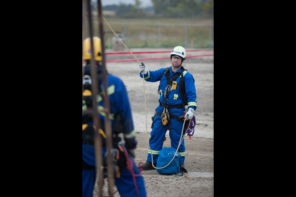 Dave Snow, of IRISNDT, belays a line during flare stack work.