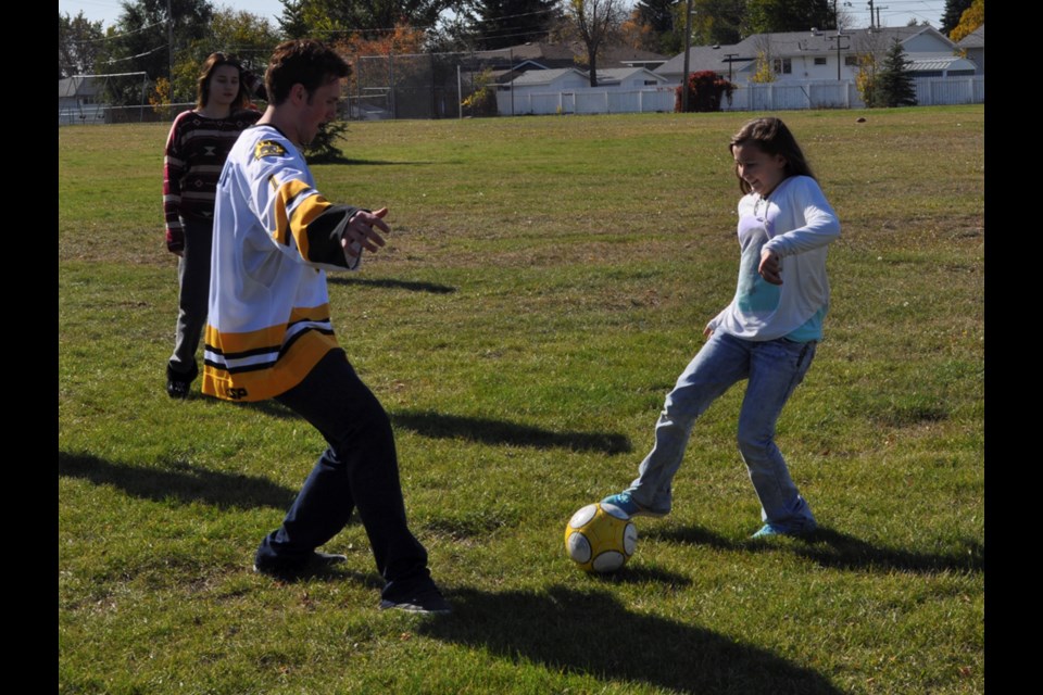 Hanna tries to deke Bruins goaltender Nathan Alalouf during a game of soccer at Hillcrest School.