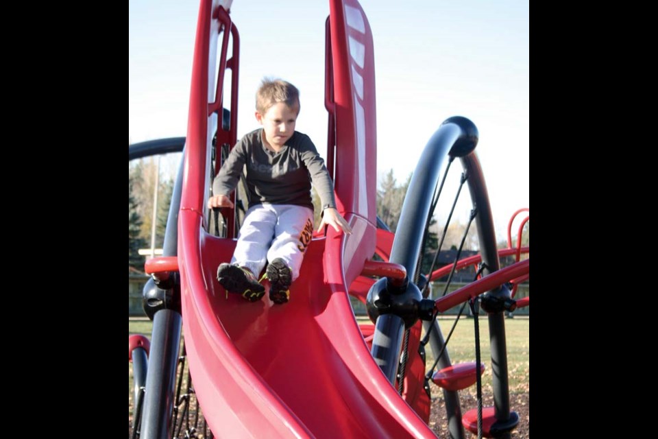 On the slide – Fine fall days are ideal for some park fun. On the Thanks­giving weekend that meant Kayden Molnar took advantage of a warm Saturday afternoon to head to one of the fine park areas in the city for some fun.