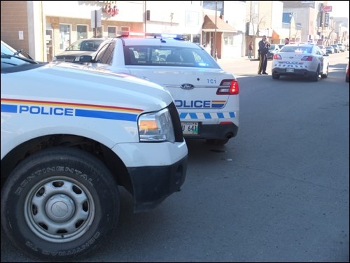 RCMP cruisers near the scene of Friday's incident in which a vehicle made contact with a child.