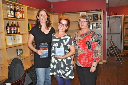 Author Lisa Guenther, musician Carmen Loncar and Battlefords Interval House executive director Ann McArthur at the North Battleford stop on the Secret Fire Tour, launching Guenther's first novel and Loncar's first CD. A draw was held to raise funds for Interval House as part of the evening. Photos by Jayne Foster