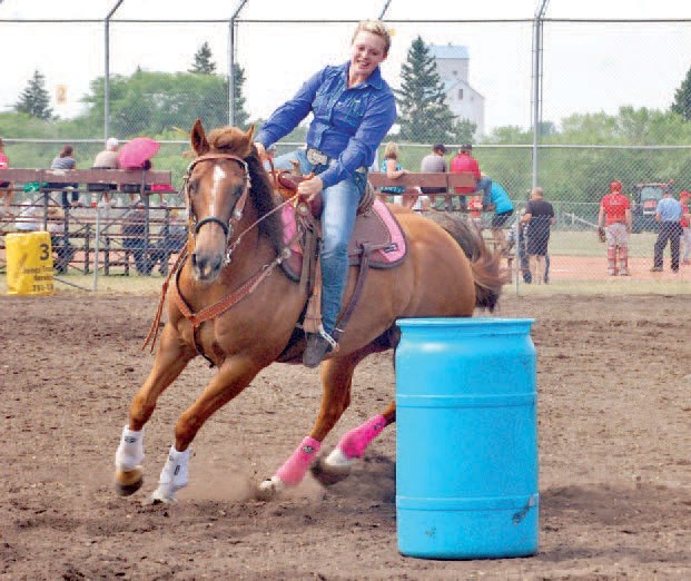 Rachelle Johannesson demonstrated her skills as she took her horse around the barrels at the gymkhana on July 11-12.