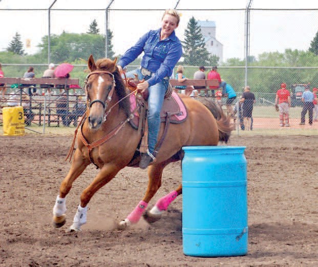 Rachelle Johannesson demonstrated her skills as she took her horse around the barrels at the gymkhana on July 11-12.