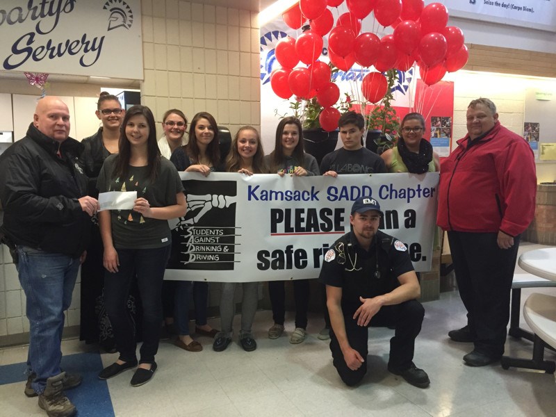Members of the KCI SADD group were photographed with 44 red balloons that were soon to be released and a banner donated by Carol Belley of The Edge Business Solutions last week when the group’s president, Kaylie Bowes accepted a donation from Jim Pollock on behalf of Duck Mountain Ambulance Care. The SADD members include Laurissa Fedorchuk and Lexie Tomochko (vice-presidents), Mikayla Woloshyn (secretary), Allison Placatka, Allison Thomsen, Breanna Bland, Devin Klapatiuk, Latisha Moar and Malee Shingoose. Also in the photo are Bill Cook, right, and Dillan Chernoff, employees of Duck Mountain Ambulance.