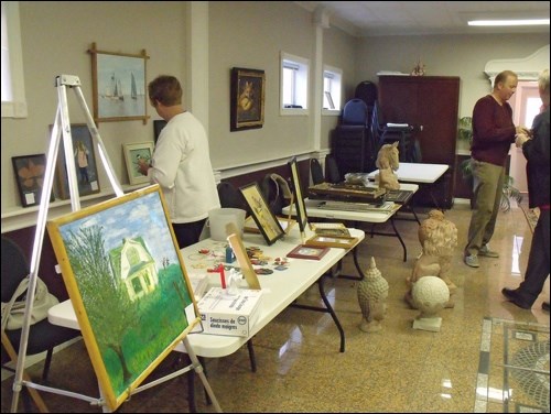 Tables set up with art work by Louise Cochran and Chris Tyreman at the Radisson craft sale. Photos by Lorraine Olinyk