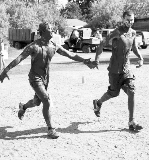 Blaze Lisoway and Brett Scebenski found their own physical appearances funny as they came to the finish line in Stenen during the Farmer’s Filthy 5 on June 6.