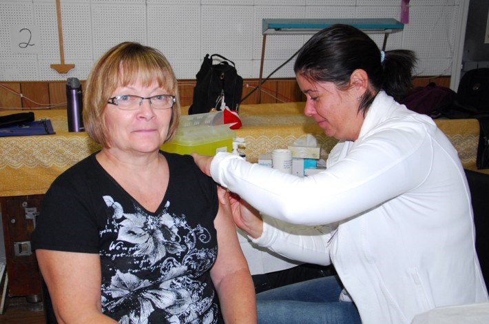 Pat Thompson of Canora received her flu shot from Carol Heskin, the Norquay public health nurse, during a clinic at the Keen Age Centre on October 22.