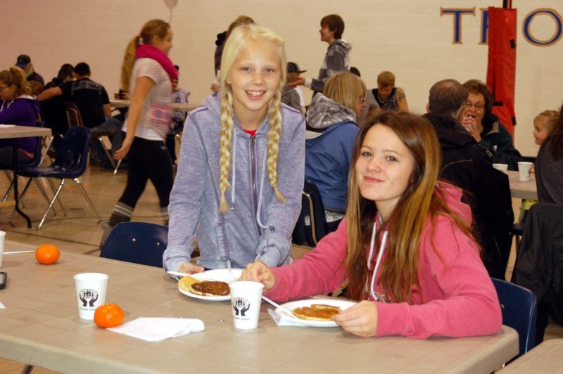 Enjoying the pancake breakfast on October 21 at the Sturgis Composite High School from left, were: Shanae Olson and Kortney Gregory.