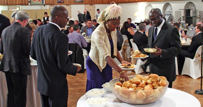 Attendees help themselves to the buffet.