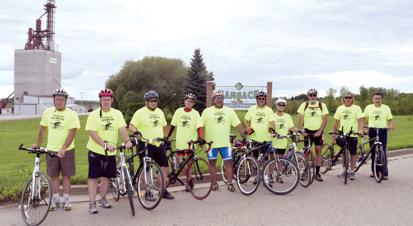 The participants of the ninth annual Old Dog Run paused for a group photo on Saturday when they arrived back in Kamsack after having cycled the distance from Kamsack to Yorkton and back. From left, the participants were: Tom Campbell, Greg Nichol, Harold Maksymetz, Ken Achtymichuk, John Ross, Joe Kozakewich, Brenda Andrews, Warren Andrews, Jim Nahnybida and Murray Chutskoff.