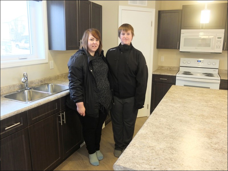 Angela Bennett and son Austin in their soon-to-be new kitchen.