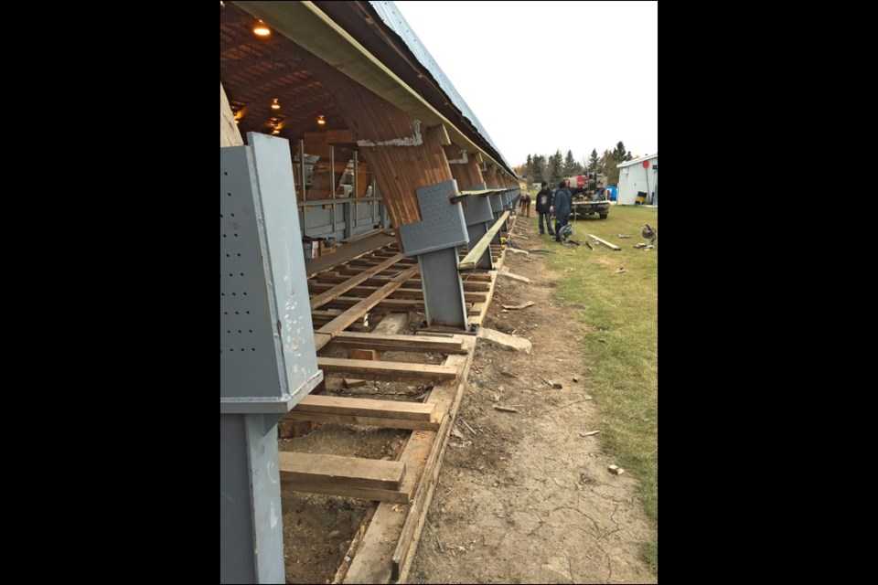 Glaslyn Skating Rink receiving repairs on the wooden arch rib supports.