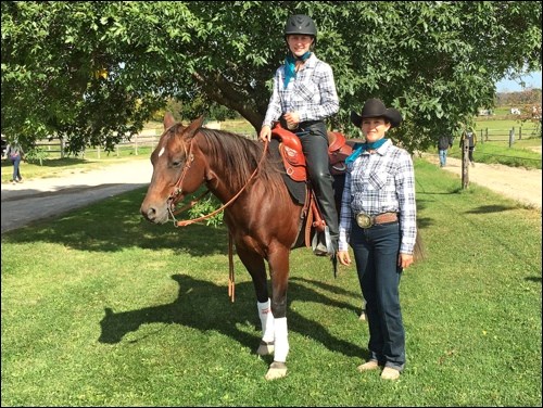 Unity Composite High School student Cyane Sperle on her horse at the Canadian Interprovincial Equestrian Championship in Ottawa held in September alongside her coach, Shauna Getz. Photos submitted by Sherri Solomko