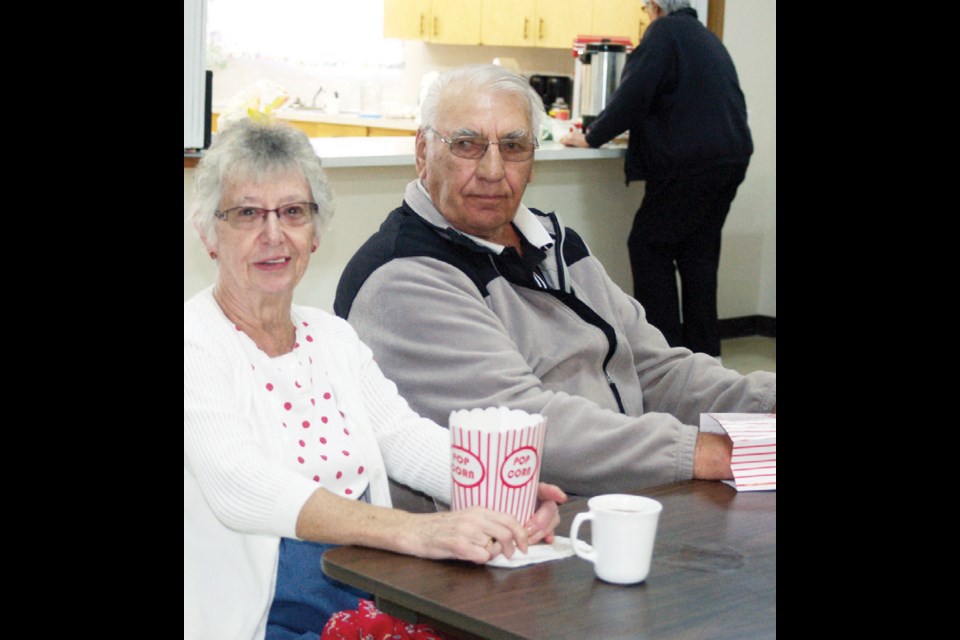 Marlene Covey, left, and William Kardynal sat back to and enjoyed the seniors’ appreciation movie afternoon.
